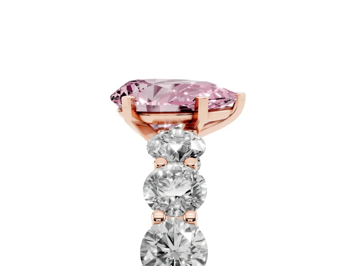Fancy Pink Pear Cut Diamond Prong Setting with Side Stones on a Pave Band Rose gold