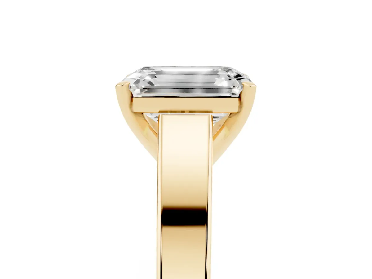 Emerald Cut Solitaire Engagement Ring with Four-Prong Setting and Tapered Band Yellow gold