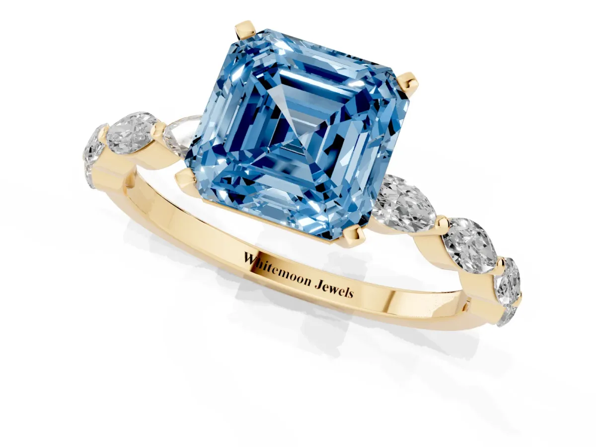 Fancy Blue Asscher Cut Diamond Ring with Marquise Side Stones and Prong Setting Yellow gold