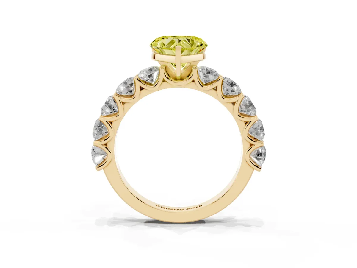 Fancy Yellow Heart Cut Diamond Prong Setting with Side Stones on a Pave Band Yellow gold