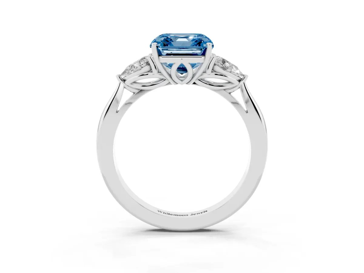 Fancy Blue Three-Stone Asscher Cut Brilliant Diamond Solitaire Ring with Tapered Band and Four-Prong Setting Platinum