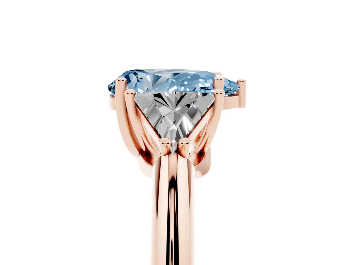 Fancy Blue Three-Stone Pear Cut Diamond Engagement Ring with Trillion Side Stones and Prong Setting Rose gold