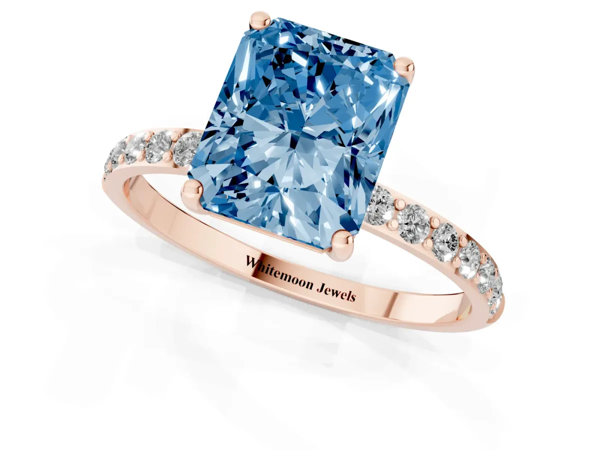 Fancy Blue Radiant Cut Diamond Solitaire Ring with Round Pavé Shoulders and Prong Setting Rose gold