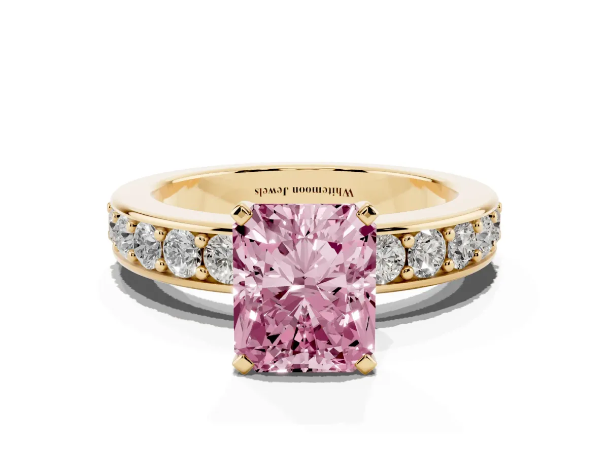 Fancy Pink Radiant Cut Diamond Engagement Ring with Channel Set Round Band and Prong Setting Yellow gold