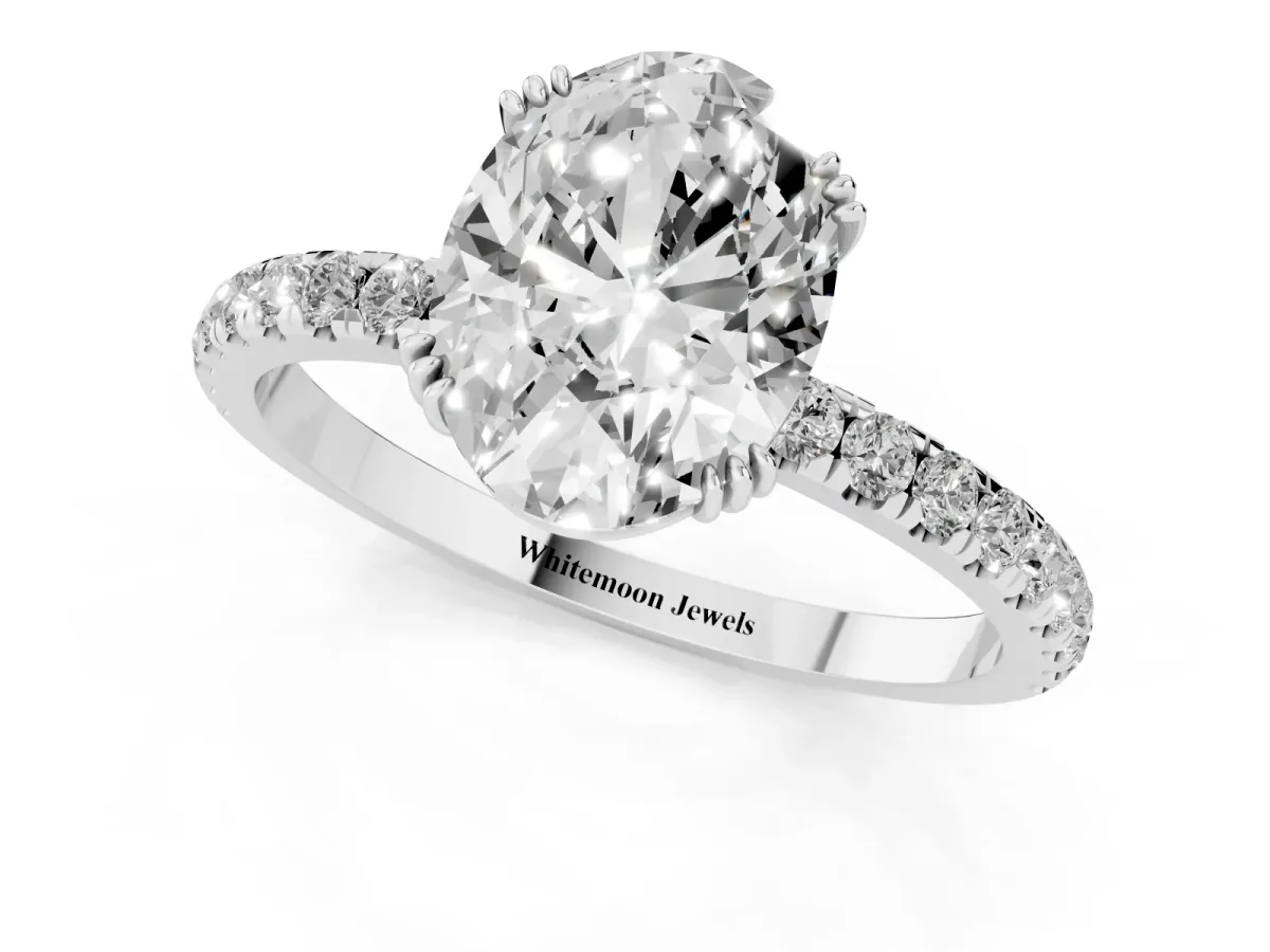Oval Cut Brilliant Solitaire with Pavé Band and Claw Prong Setting Silver