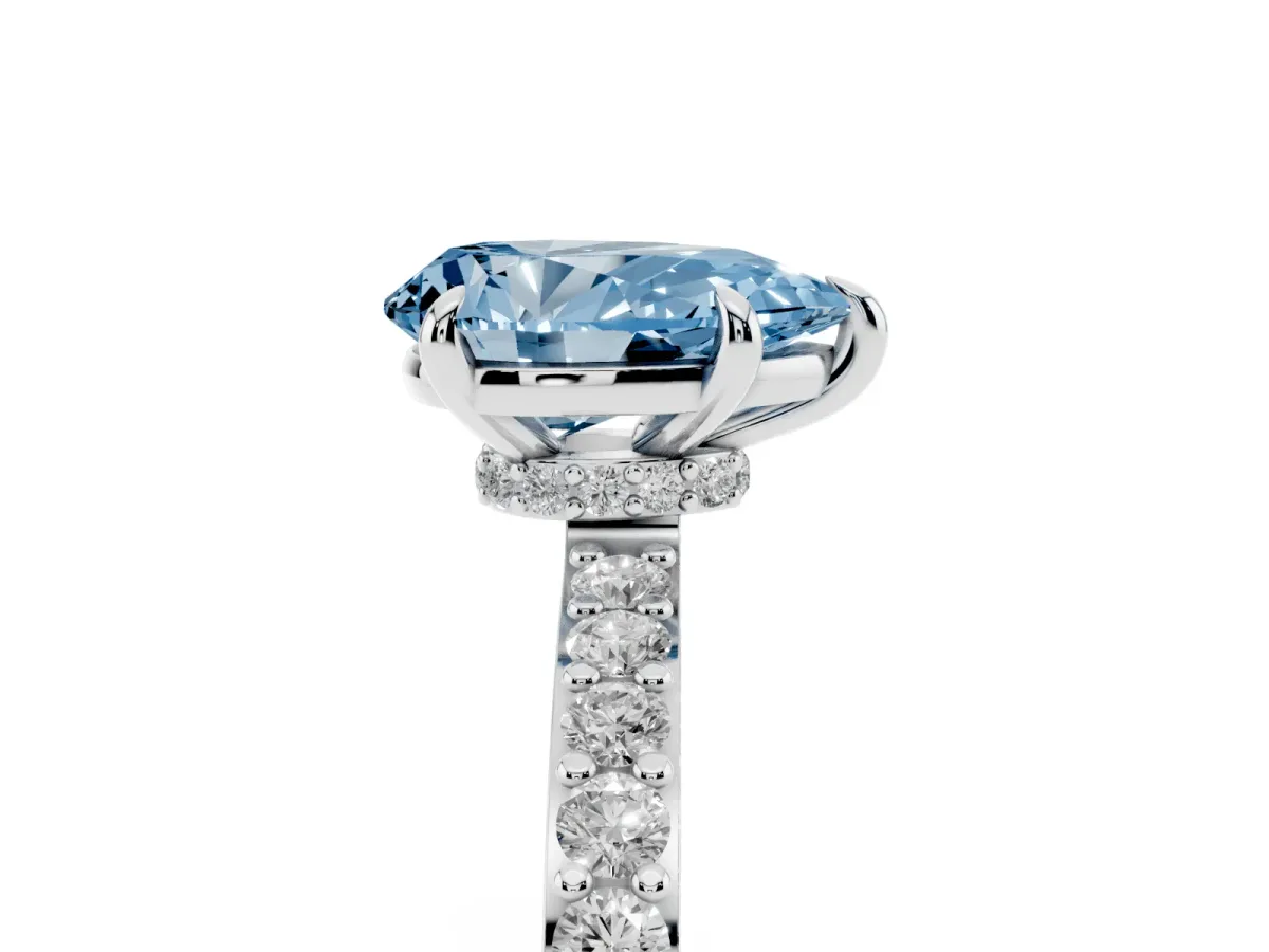 Fancy Blue Pear Cut Diamond Pavé Engagement Ring with Round Accents and Prong Setting Platinum