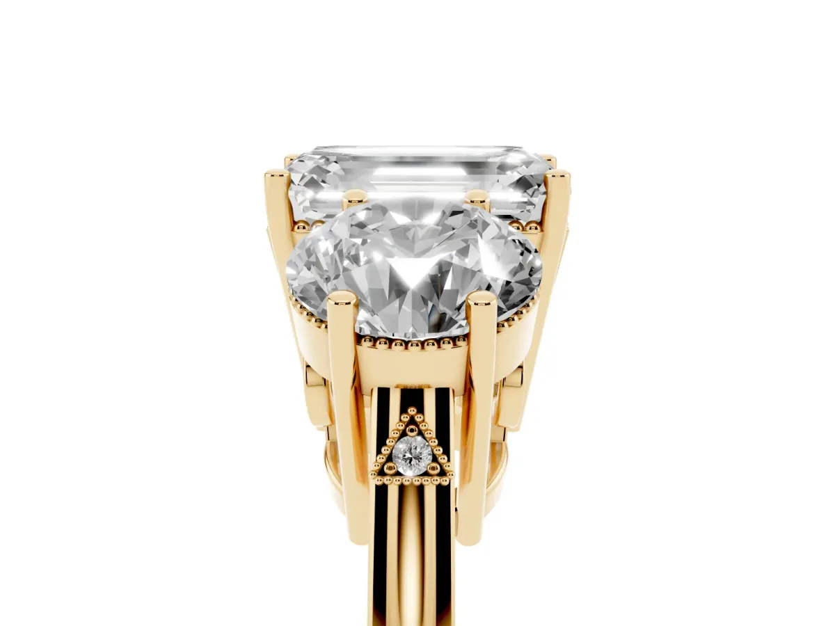 Three-Stone Emerald Cut Diamond Engagement Ring with Prong Setting on a Classic Band Yellow gold