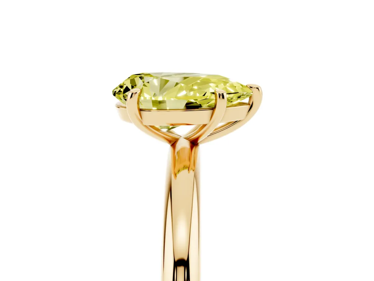 Fancy Yellow Pear Cut Solitaire Diamond Ring with Four-Prong Setting on a Plain Band Yellow gold