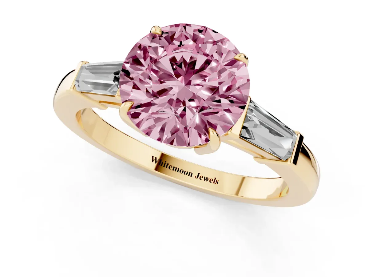 Fancy Pink Round Cut Diamond Three-Stone Ring with Tapered Baguette Side Stones and Prong Setting Yellow gold