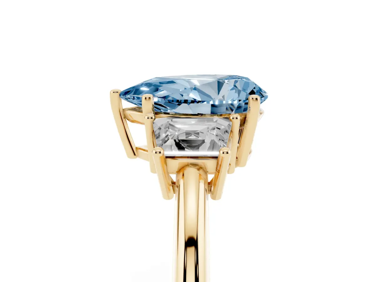 Fancy Blue Pear Cut Diamond Three-Stone Ring with Trapezoid Side Stones and Prong Setting Yellow gold