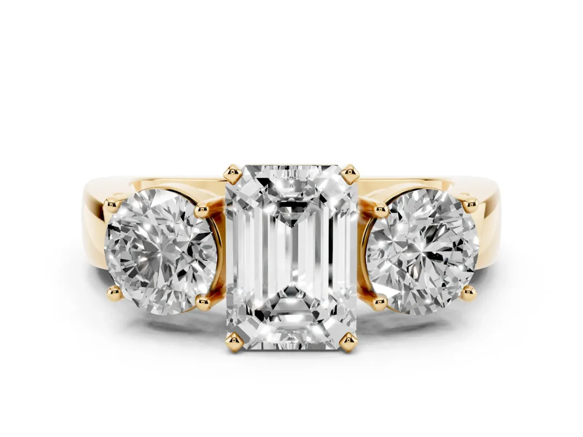 Three-Stone Emerald Cut Diamond Ring with Round Side Stones, Classic Band, and Four-Prong Setting Yellow gold