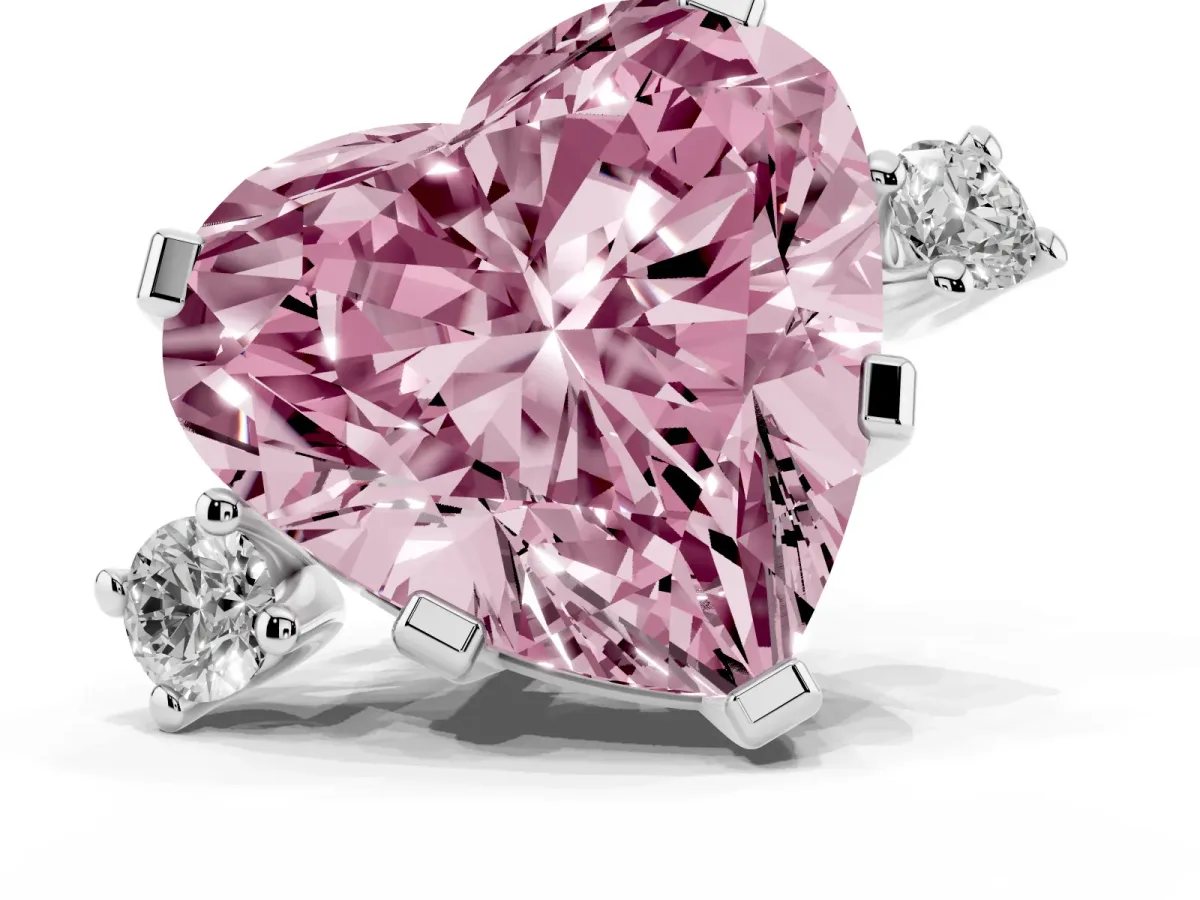 Fancy Pink Heart Cut Cut Three-Stone Solitaire Ring with Round Accent Diamonds and Four-Prong Setting Silver