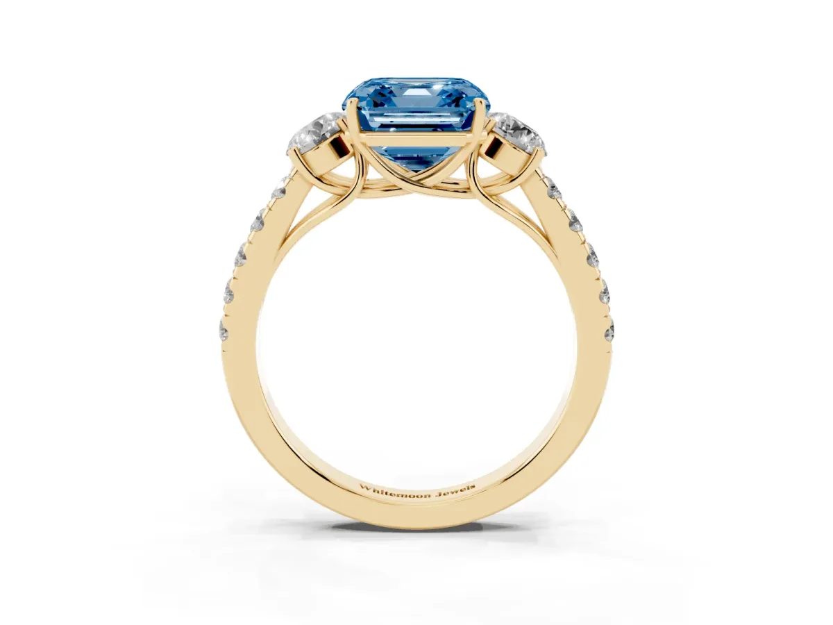 Fancy Blue Asscher Cut Cut Diamond Three-Stone Ring with Round Side Stones and Pavé Band Yellow gold
