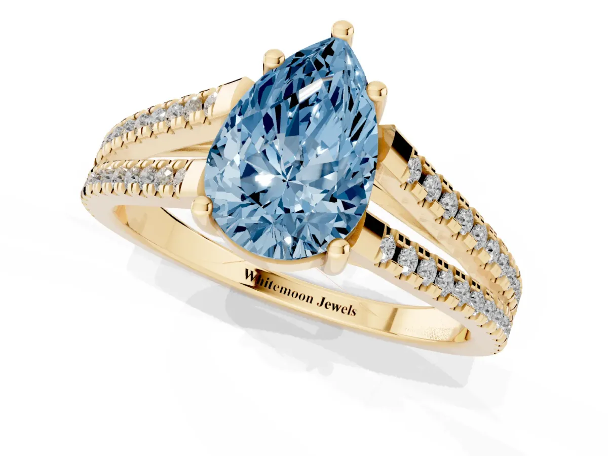 Fancy Blue Pear Cut Diamond Solitaire Engagement Ring with Split Shank Pavé Band Yellow gold