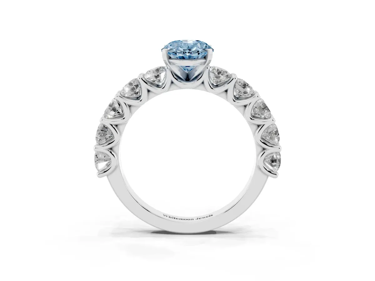 Fancy Blue Oval Cut Diamond Prong Setting with Side Stones on a Pave Band Silver
