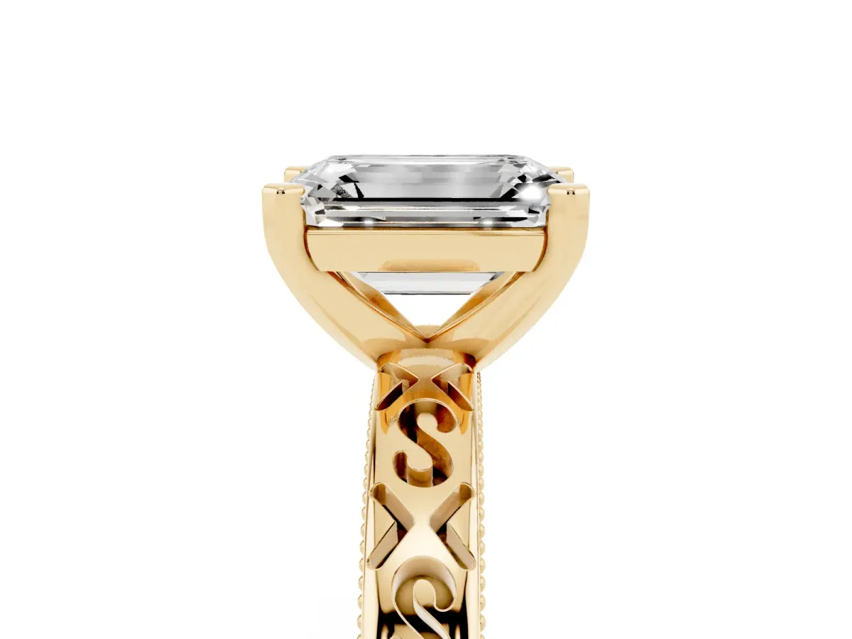 Emerald Cut Solitaire Engagement Ring with Scrollwork Band and Four-Prong Setting Yellow gold