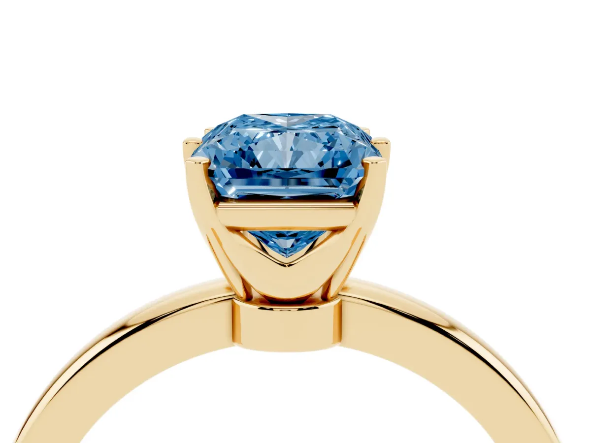 Fancy Blue Radiant Cut Solitaire Diamond Ring with Six-Prong Setting on a Classic Band Yellow gold