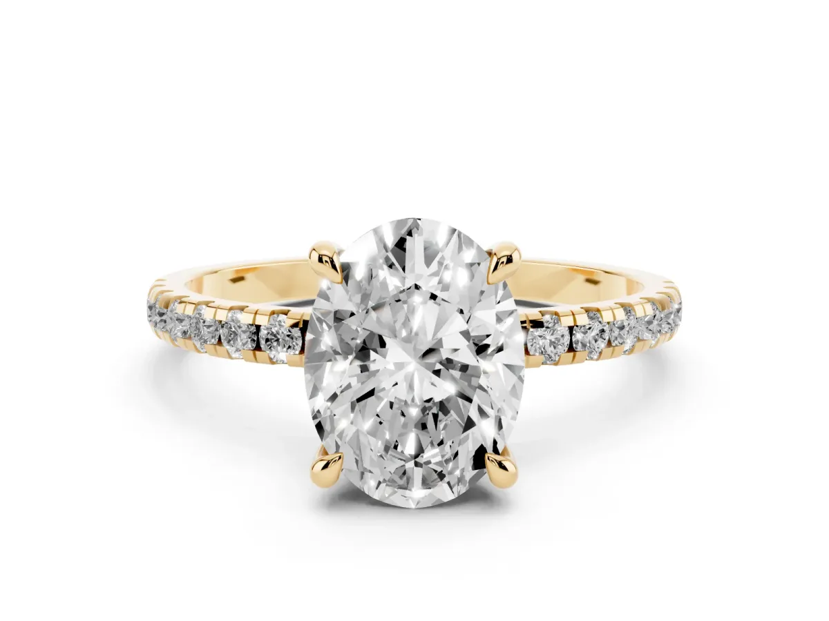 Oval Cut Diamond Brilliant Solitaire Ring with Pavé Band and Four-Prong Setting Yellow gold