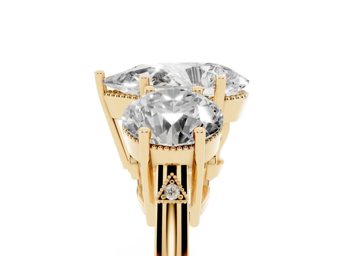 Three-Stone Pear Cut Diamond Engagement Ring with Prong Setting on a Classic Band Yellow gold