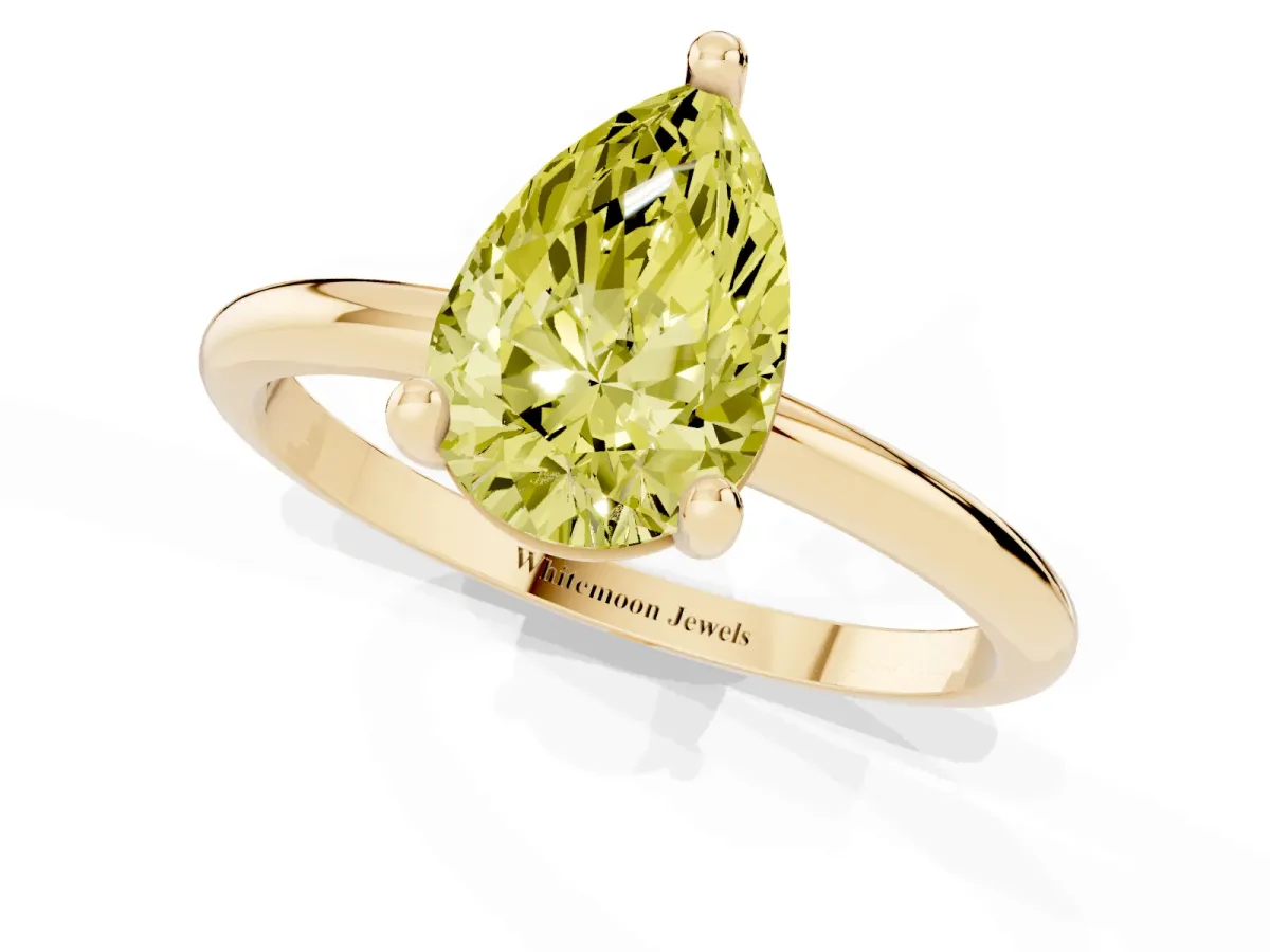 Fancy Yellow Pear Cut Solitaire Diamond Ring with 4-Prong Setting on a Classic Band Yellow gold