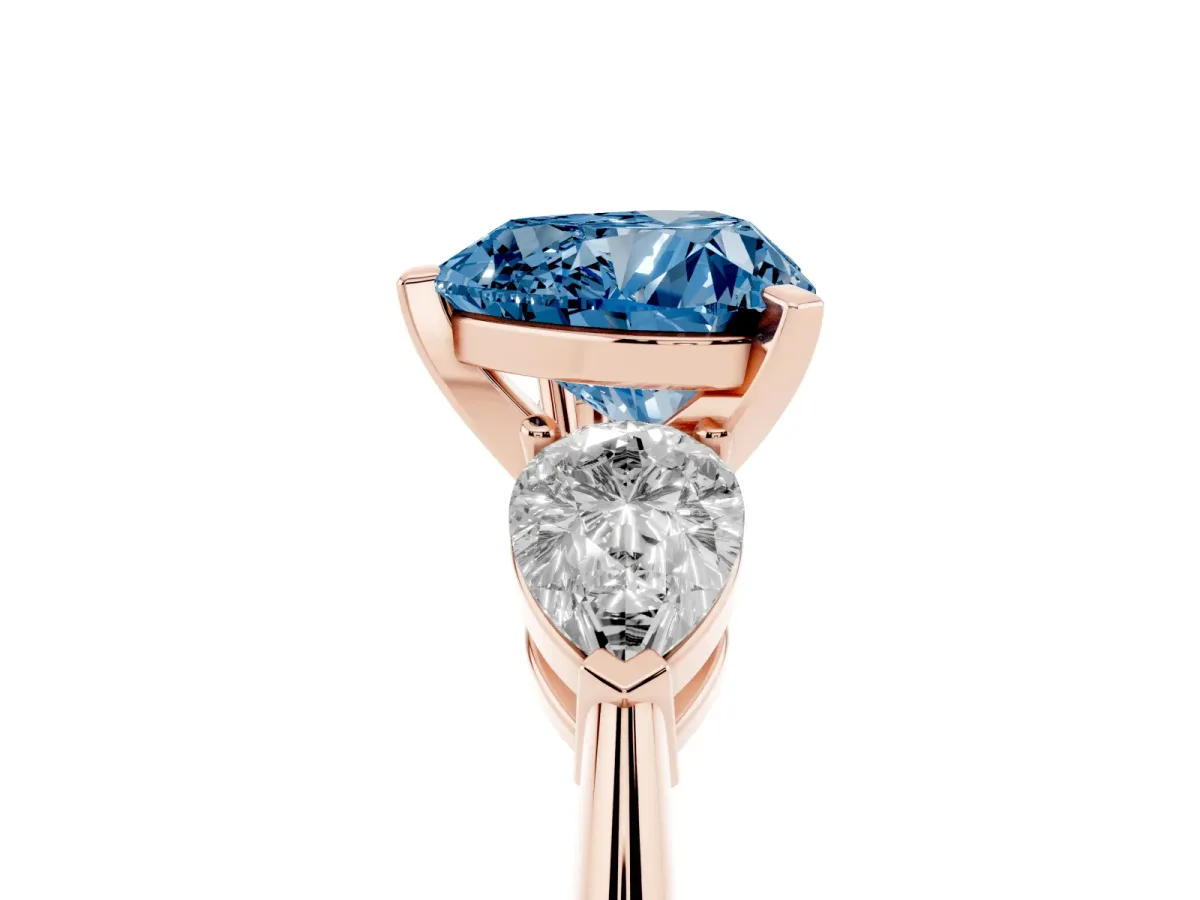Fancy Blue Three-Stone Heart Cut Diamond Ring with Pear Side Stones and Four-Prong Setting Rose gold