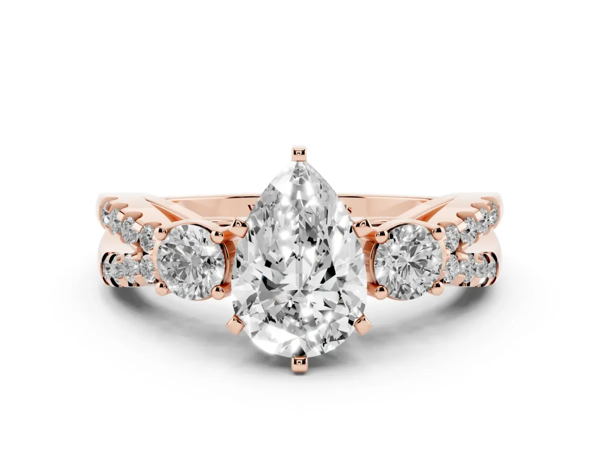 Pear Cut Diamond Three-Stone Ring with Pavé Split Shank and Four-Prong Setting Rose gold