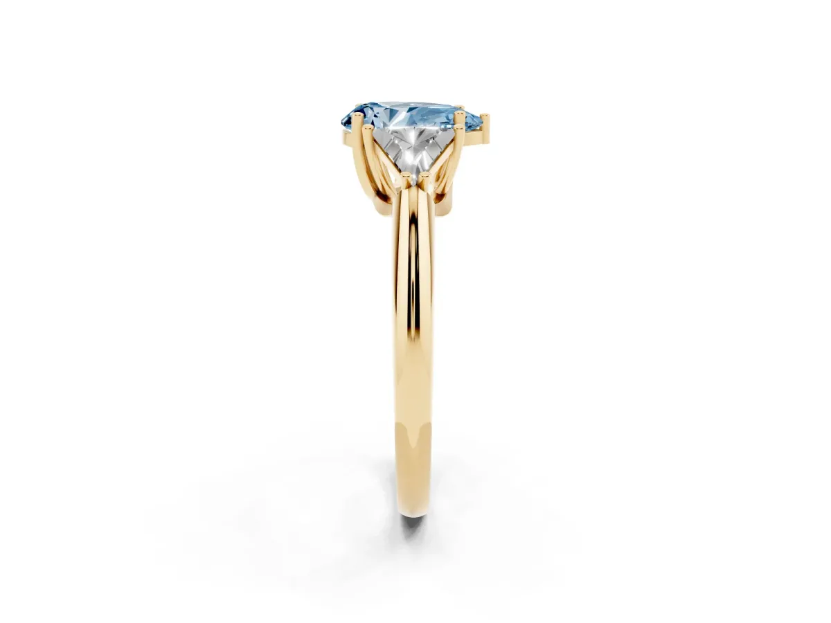 Fancy Blue Three-Stone Pear Cut Diamond Engagement Ring with Trillion Side Stones and Prong Setting Yellow gold