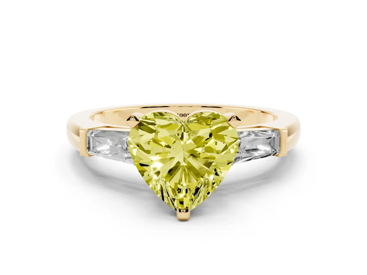 Fancy Yellow Heart Cut Solitaire with Tapered Baguette Side Stones on a Classic Band with Four-Prong Setting Yellow gold