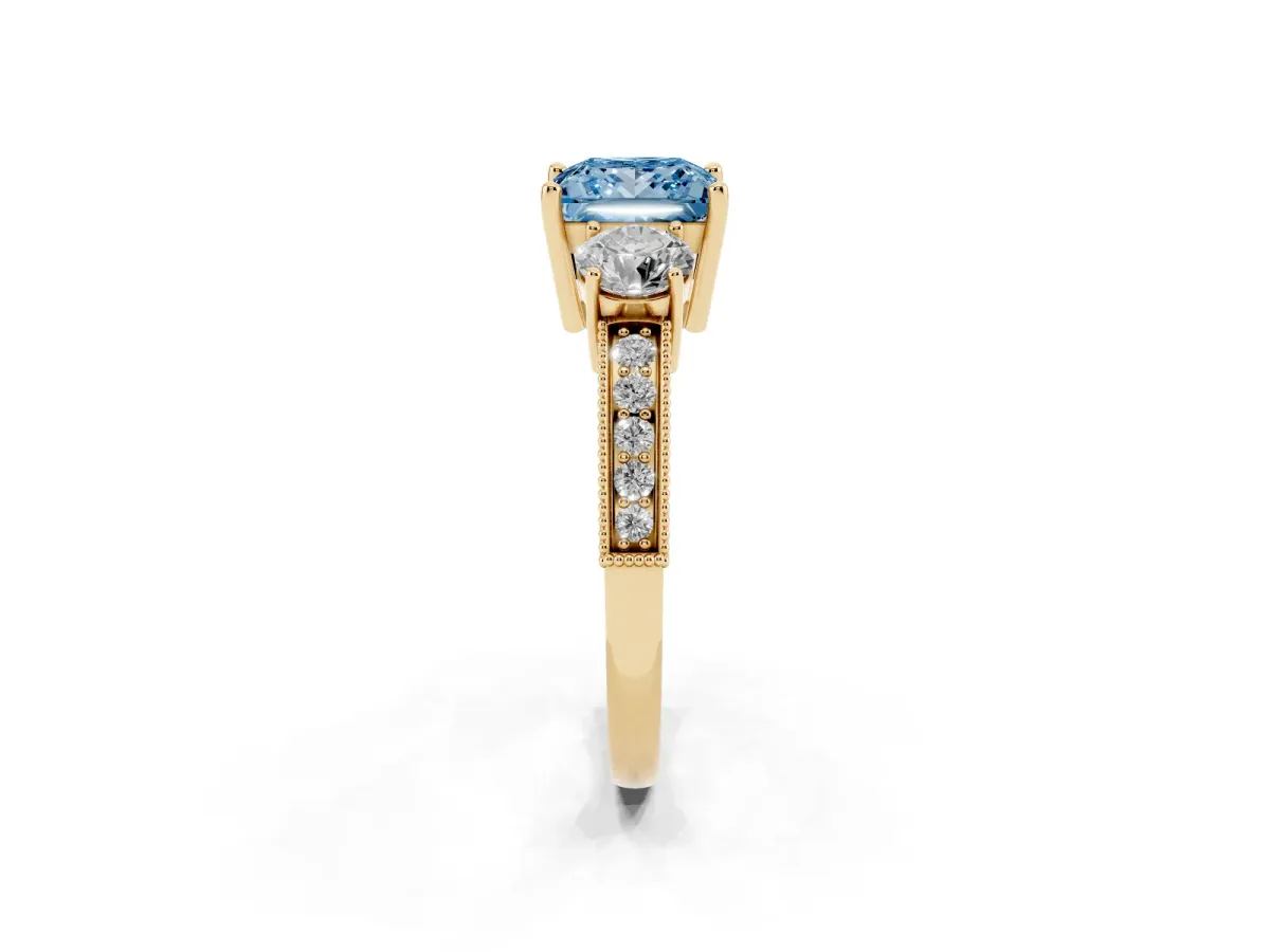Fancy Blue Princess Cut Three-Stone Diamond Ring with Pavé Band and Four-Prong Setting Yellow gold