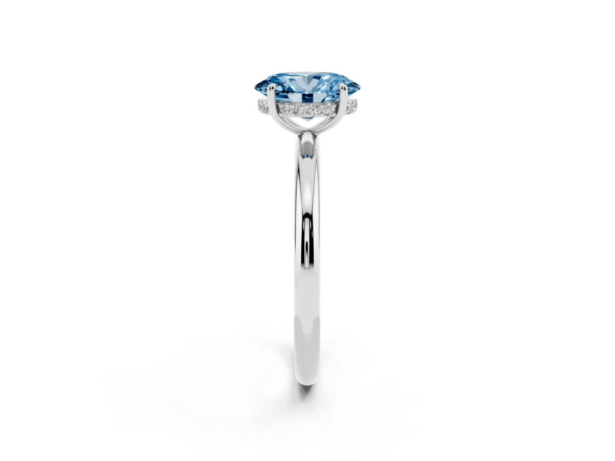 Fancy Blue Oval Cut Diamond Solitaire Ring with Thin Band and Four-Prong Setting Silver