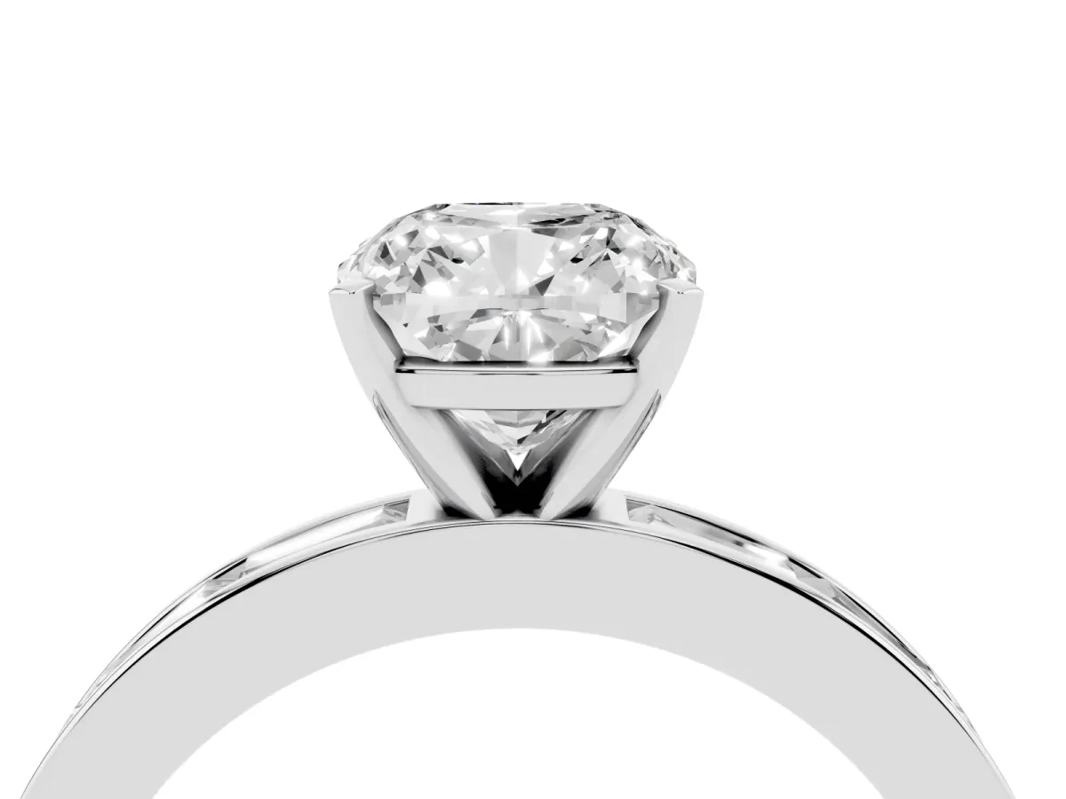Cushion Cut Solitaire Diamond Ring with Channel-Set Baguette Band and Four-Prong Setting Platinum
