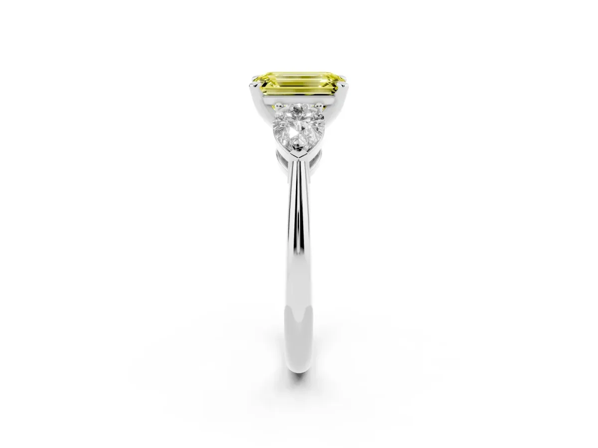 Fancy Yellow Three-Stone Emerald Cut Diamond Ring with Pear Side Stones and Four-Prong Setting Silver