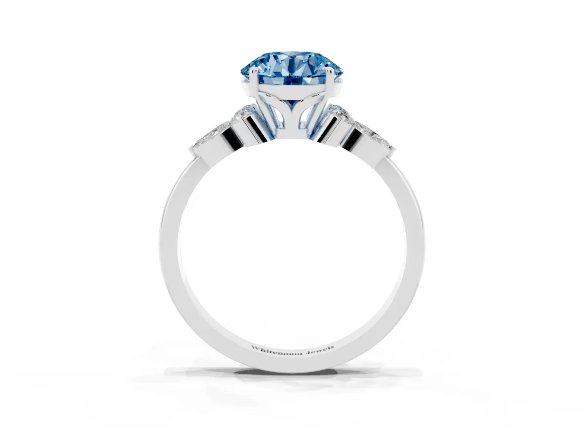 Fancy Blue Round Cut Brilliant Diamond Solitaire Ring with Pear Side Stones and Four-Prong Setting Silver