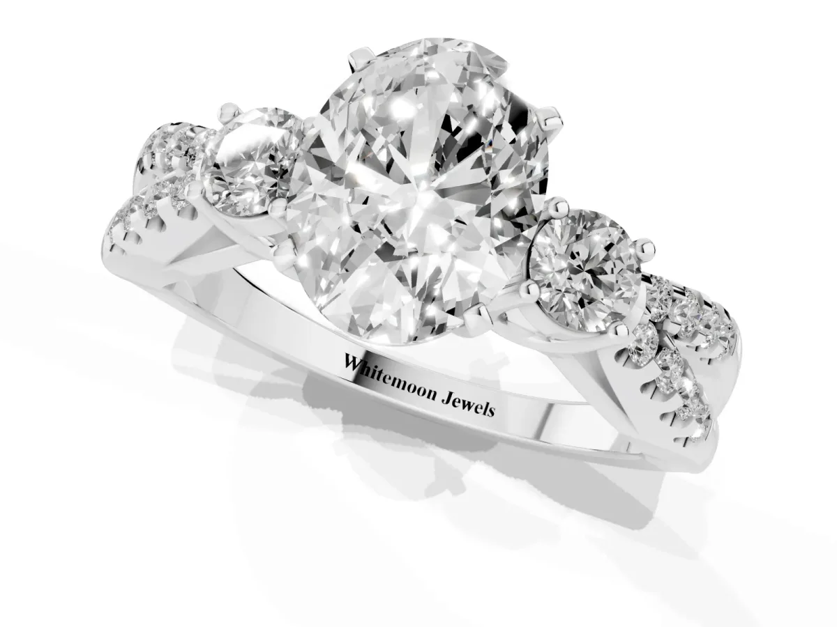 Oval Cut Diamond Three-Stone Ring with Pavé Split Shank and Four-Prong Setting Platinum