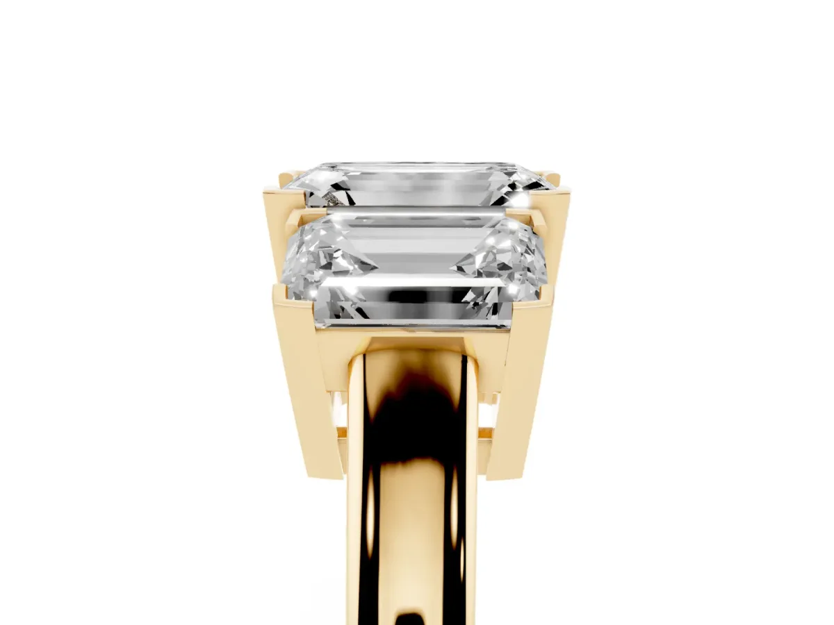 Three-Stone Emerald Cut Cut Diamond Ring with Channel Set Band and Four-Prong Setting Yellow gold