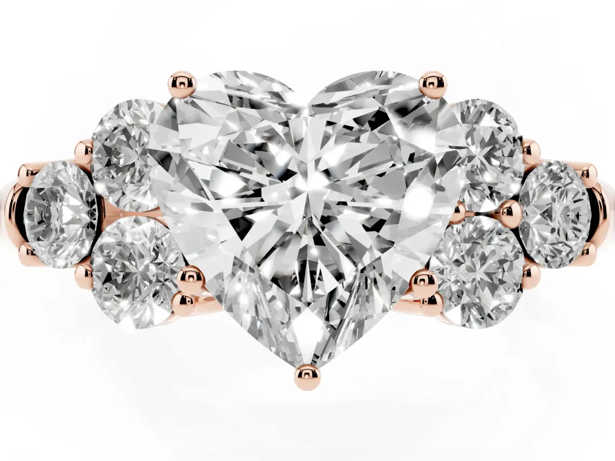 Heart Cut Cut Diamond Cluster Ring with Round Accent Stones and Prong Setting on a Classic Band Rose gold