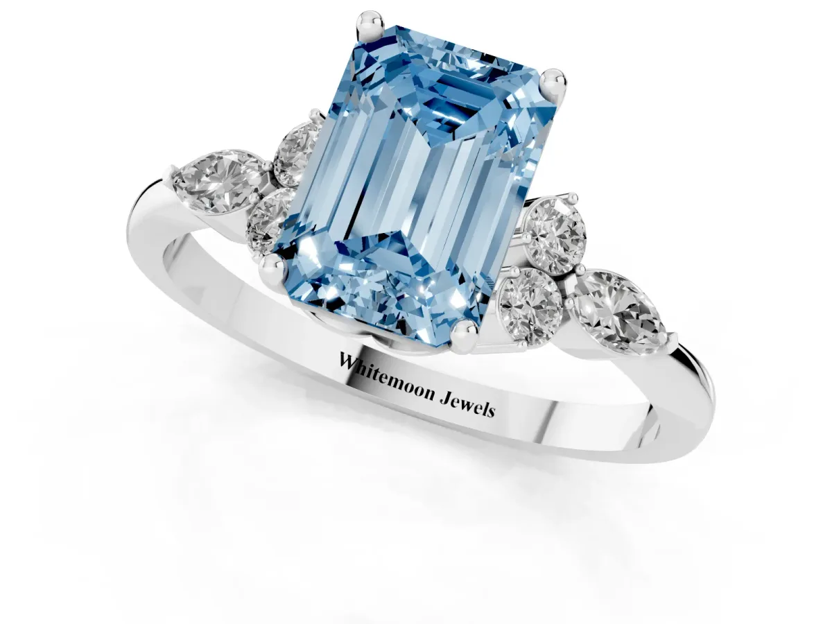 Fancy Blue Emerald Cut Brilliant Diamond Solitaire Ring with Pear Side Stones and Four-Prong Setting Silver