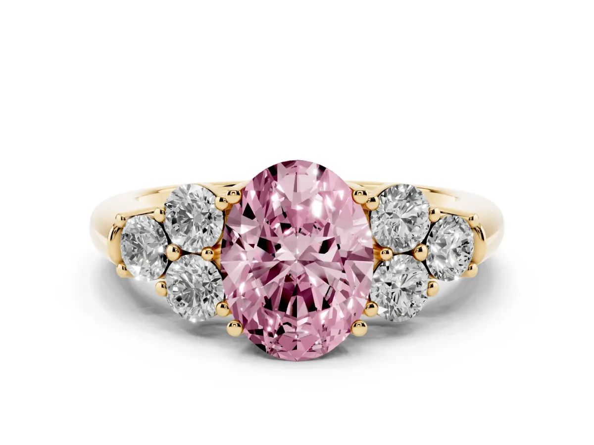 Fancy Pink Oval Cut Cut Diamond Cluster Ring with Round Accent Stones and Prong Setting on a Classic Band Yellow gold