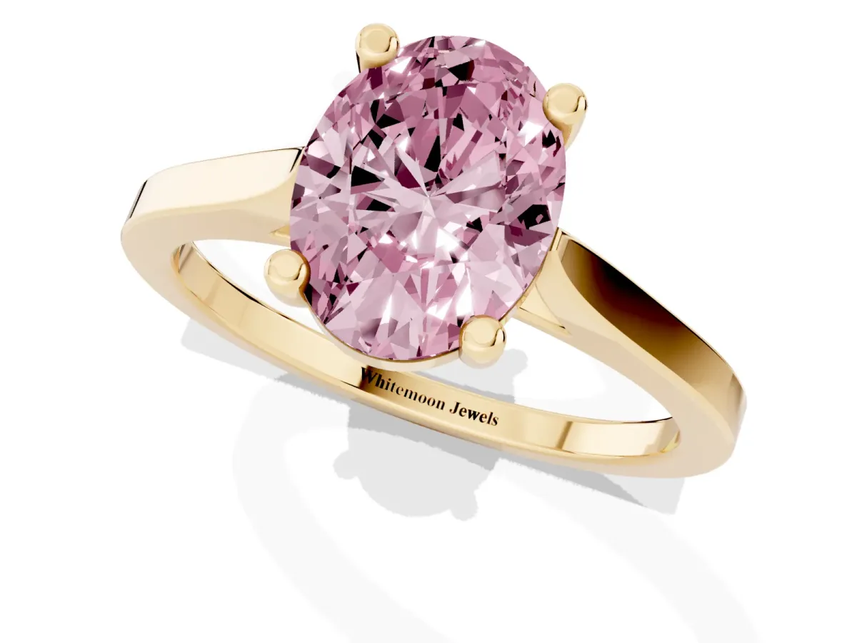 Fancy Pink Oval Cut Solitaire Diamond Ring with Four-Prong Setting and Tapered Band Yellow gold