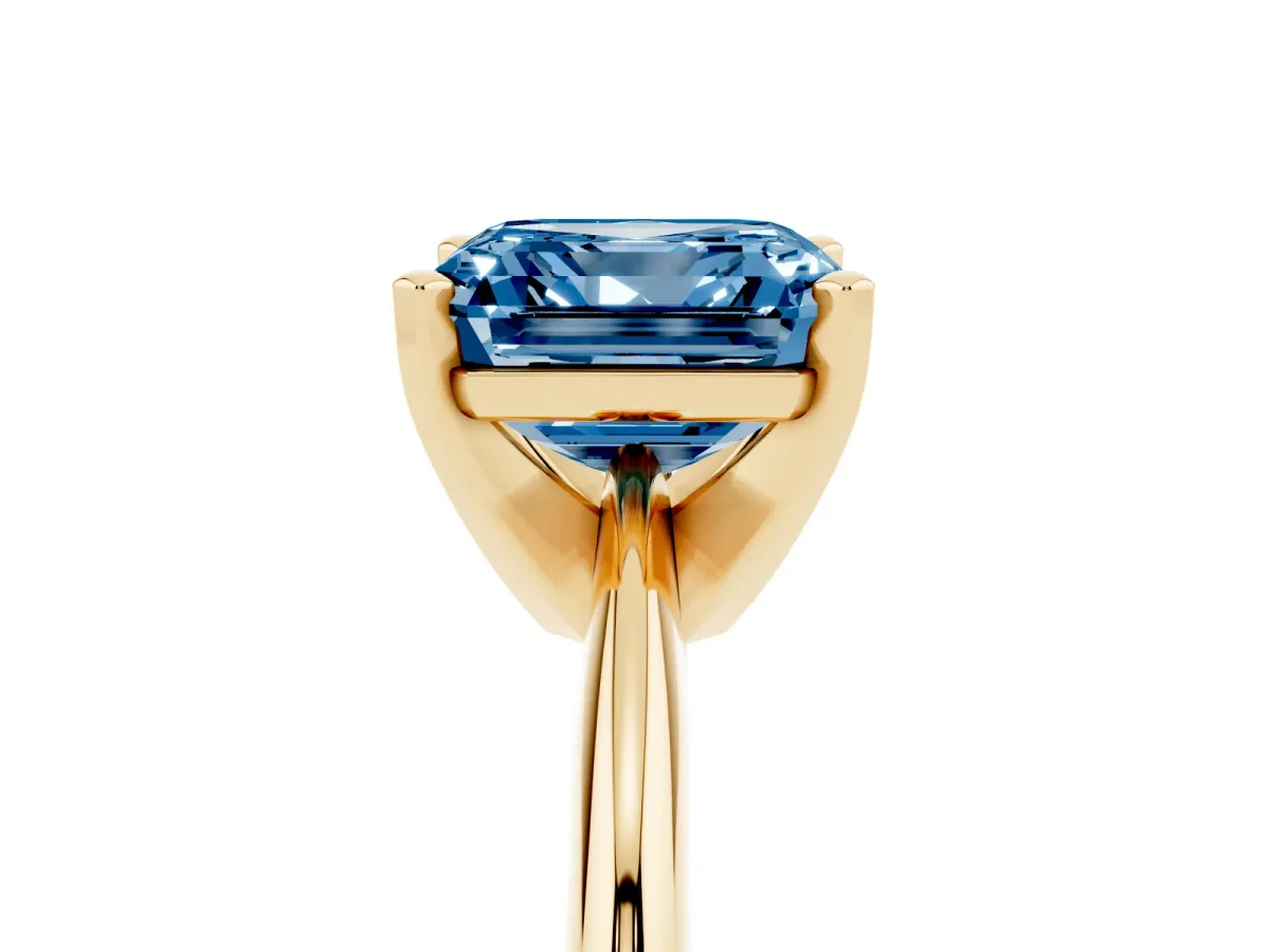 Fancy Blue Asscher Cut Cut Solitaire Ring with Four-Prong Setting on a Classic Band Yellow gold