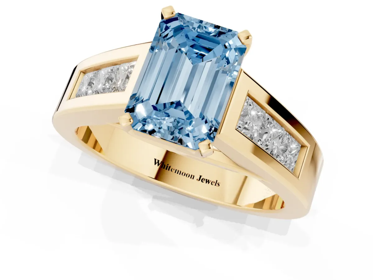 Fancy Blue Emerald Cut Cut Channel Set Solitaire Ring with Four-Prong Setting Yellow gold