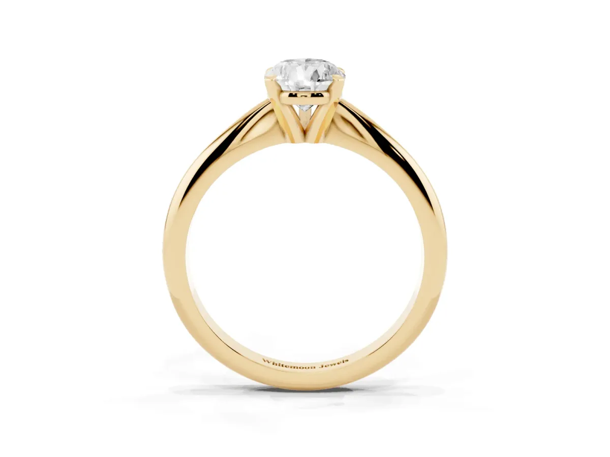 Pear Cut Cut Solitaire Ring with Four-Prong Setting on a Classic Band Yellow gold