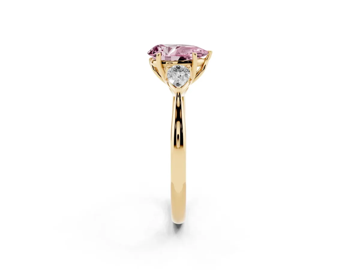 Fancy Pink Three-Stone Pear Cut Diamond Ring with Pear Side Stones in Four-Prong Setting Yellow gold