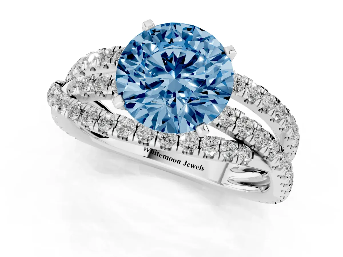 Fancy Blue Round Cut Solitaire Twist Band with Pavé Setting and Four-Prong Setting Silver