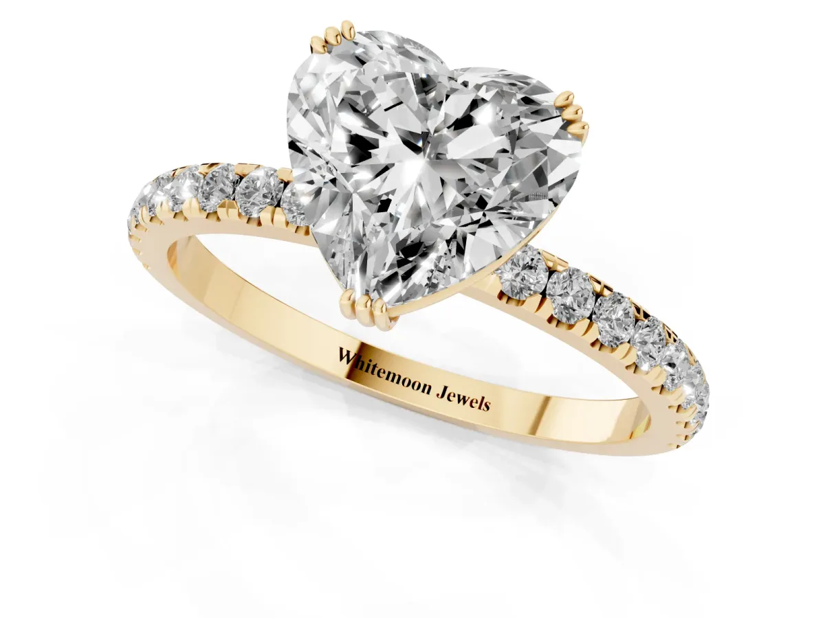 Heart Cut Brilliant Solitaire with Pavé Band and Claw Prong Setting Yellow gold