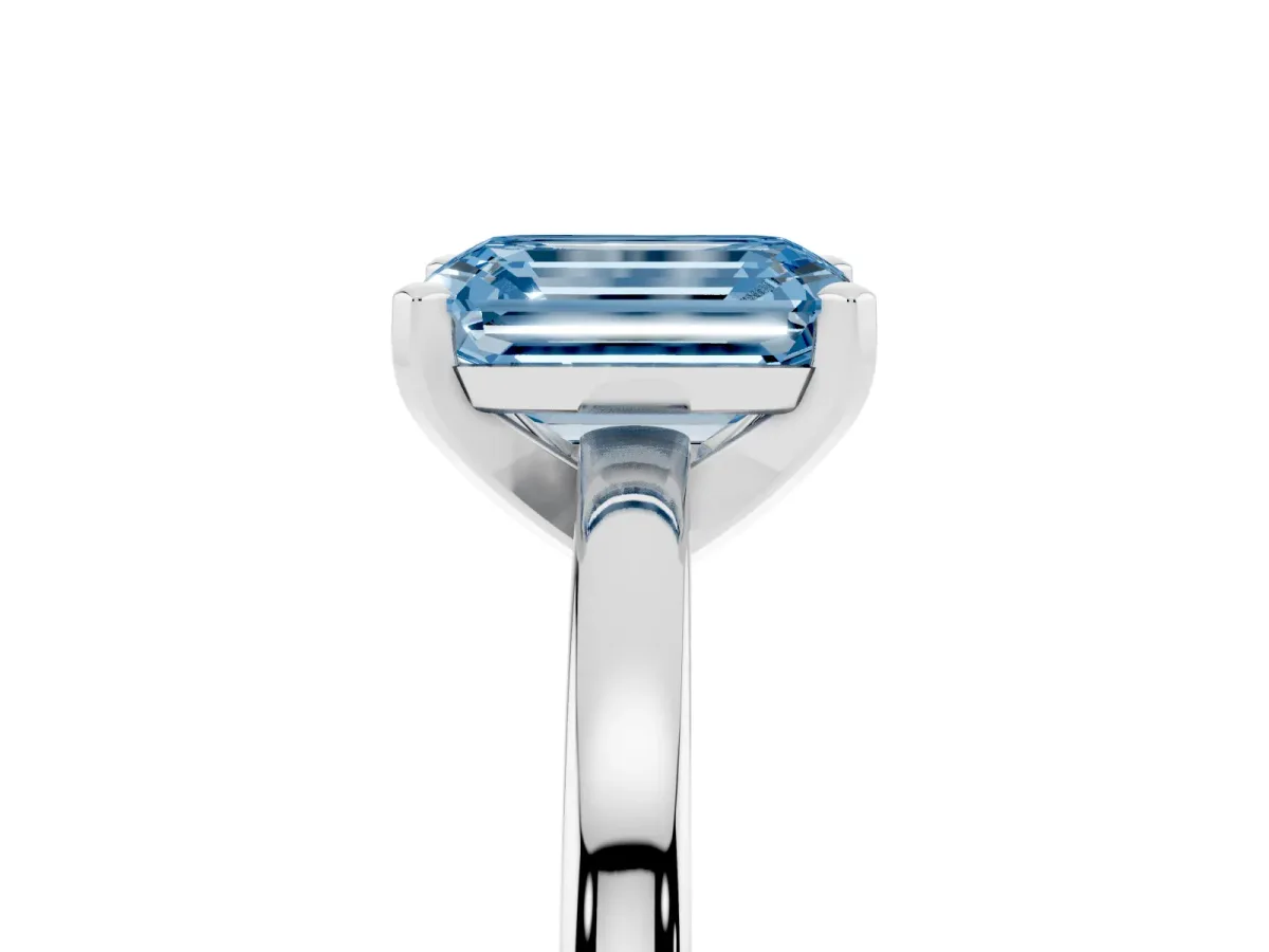 Fancy Blue Emerald Cut Solitaire Diamond Engagement Ring with Four-Prong Setting on a Classic Band Silver