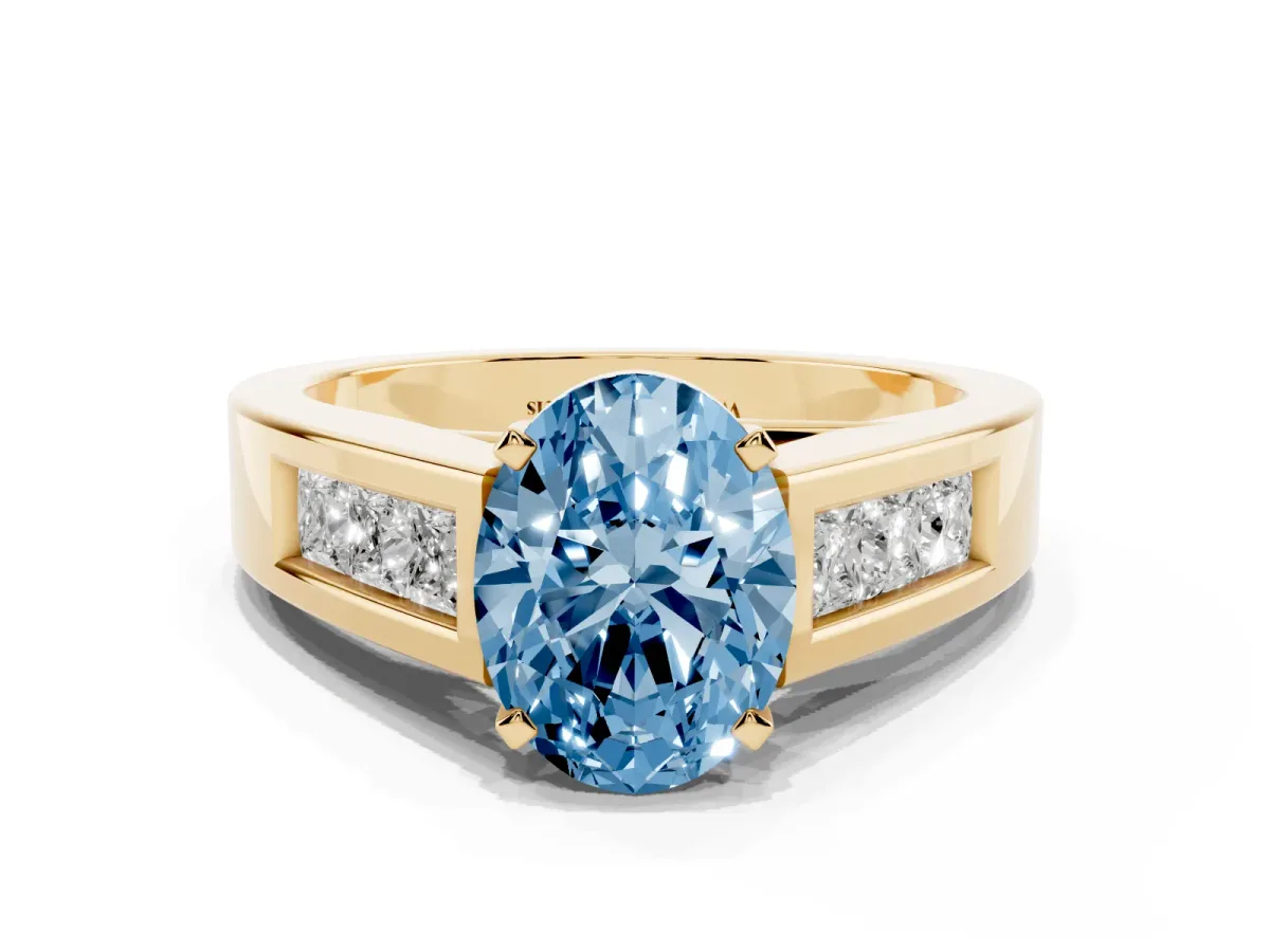 Fancy Blue Oval Cut Cut Channel Set Solitaire Ring with Four-Prong Setting Yellow gold