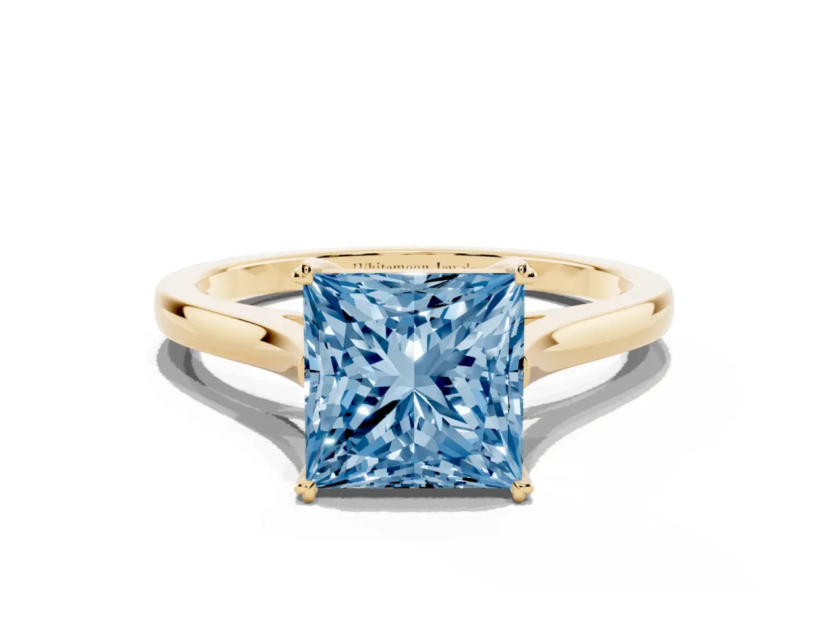 Fancy Blue Princess Cut Solitaire Heart Prong Engagement Ring with Tapered Band Yellow gold