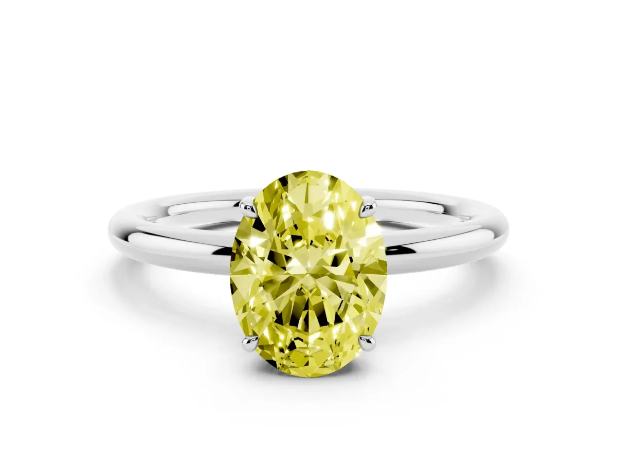 Fancy Yellow Oval Cut Diamond Solitaire Ring with Thin Band and Four-Prong Setting Silver