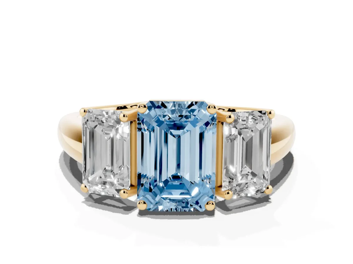 Fancy Blue Three-Stone Emerald Cut Diamond Engagement Ring with Prong Setting Yellow gold